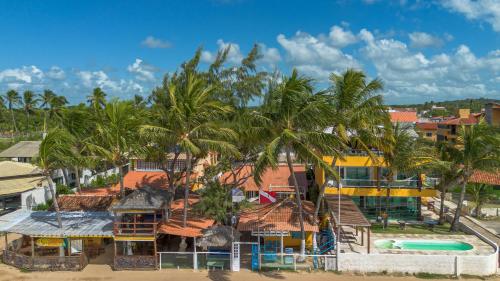 an aerial view of a resort with a swimming pool at Pousada La Bella Luna in Porto De Galinhas