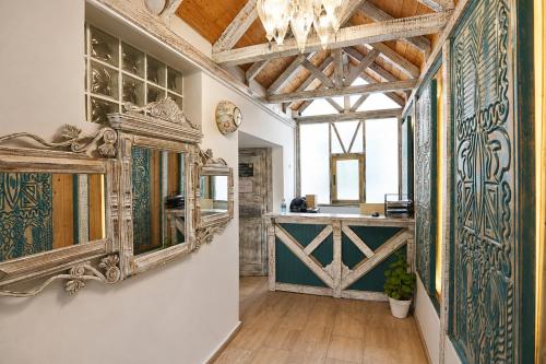 a room with a mirror on the wall and a counter at Payam Agora Hotel Room Only , Shared Terrace & Kitchen in Kaş