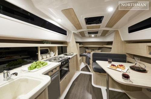 a kitchen with a sink and a counter with food on it at La Rochelle sur L'eau in La Rochelle