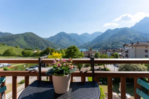 a potted plant sitting on a table on a balcony at Ledro Lake Suites in Ledro