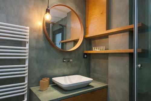 a bathroom with a sink and a mirror at Brand-New Spacious 3 Bd Apt in Piraeus in Piraeus