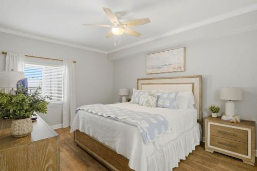 a bedroom with a bed and a ceiling fan at SeaSpray Riverside 112 in Perdido Key