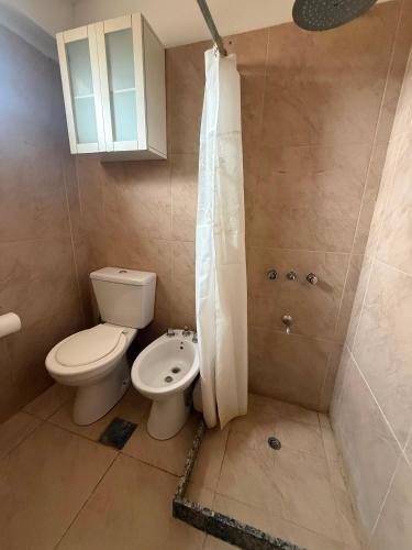 a bathroom with a toilet and a shower at General Acha 869 in San Juan