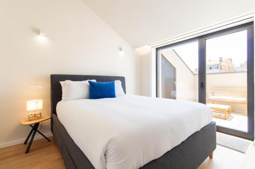 Coastal 3BR Duplex w Terrace by LovelyStay