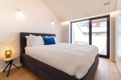 Coastal 3BR Duplex w Terrace by LovelyStay
