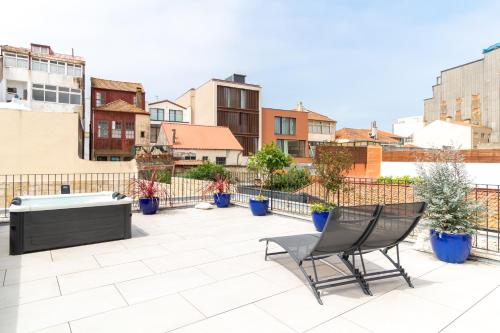 Coastal 3BR Duplex w Terrace by LovelyStay