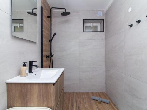 a bathroom with a white sink and a shower at Old Town Spot Apartment by Stay ici in Albufeira