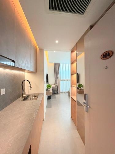 a kitchen with a sink and a counter top at Sunday Boutique Hotel in Phú Quốc
