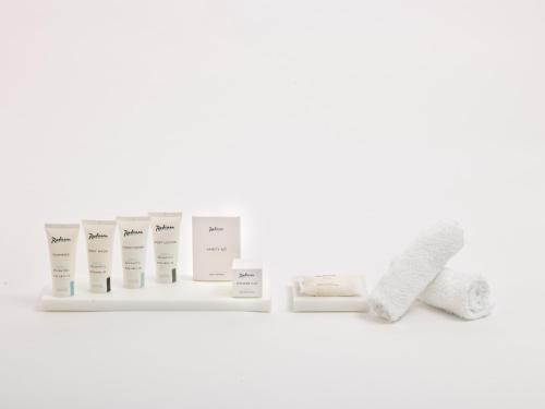 a shelf withbranded products on a white background at Radisson Hotel Berlin Charlottenburg in Berlin