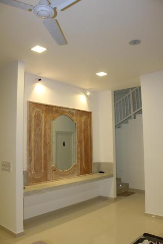 a room with a wall with a wooden partition at Heaven By O in Unawatuna