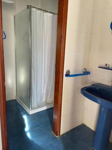 a bathroom with a shower and a sink at La Vereda - Rural getaway, pool, golf & hiking lovers in Tacoronte