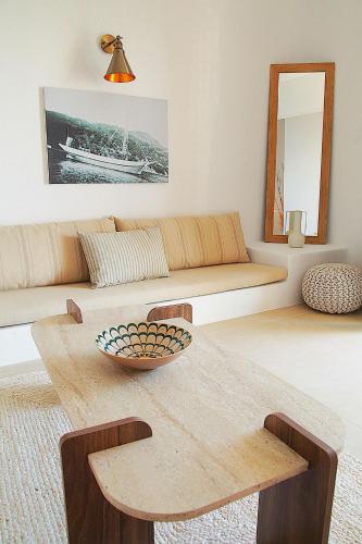 a living room with a table and a couch at To Nisi in Loutraki