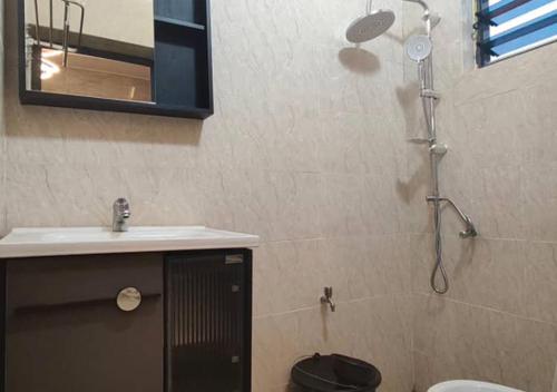 a bathroom with a sink and a shower at STUDIO Meublée à Gbodjè in Porto-Novo