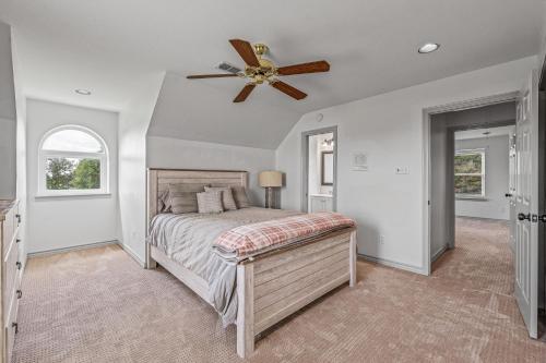 a bedroom with a bed with a ceiling fan at Crooked F Ranch in Stephenville