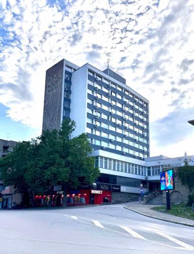 a large building on the side of a street at BALKAN TOWER- Apartment Viktoria in Gabrovo