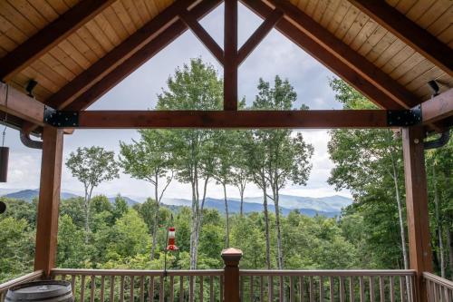 a view from the porch of a cabin with a view of the mountains at Ridgeline Cabin in Elk Park