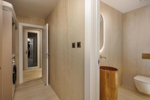 a bathroom with a toilet and a sink at Villa Sunset with swimming pool in Baška