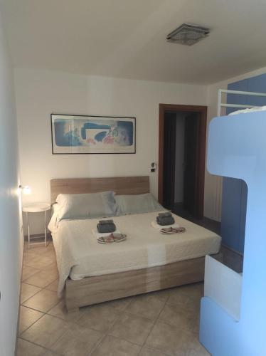 a bedroom with a bed with two towels on it at CASA BETTO in San Domenico