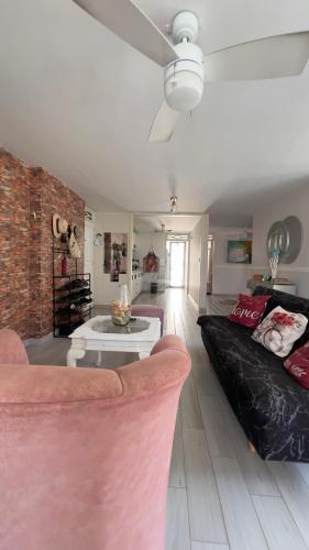 a living room with a couch and a table at Edificio Genesis in Rodadero
