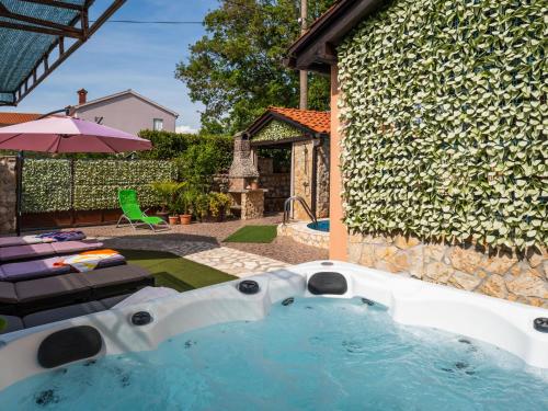 a swimming pool in the backyard of a house at Holiday Home Ana by Interhome in Šilo