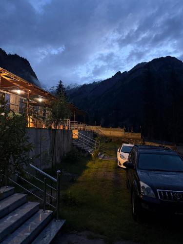 a car parked in front of a house at Anakar resort in Kalām