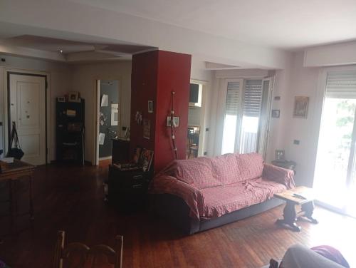 a living room with a couch and a table at Modena Sound Suite in Modena