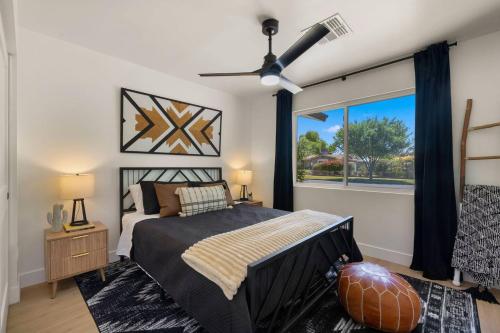 a bedroom with a large bed and a window at Page House in Gilbert