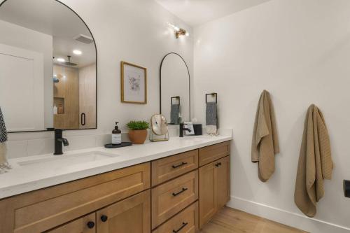 a bathroom with a sink and a mirror at Page House in Gilbert