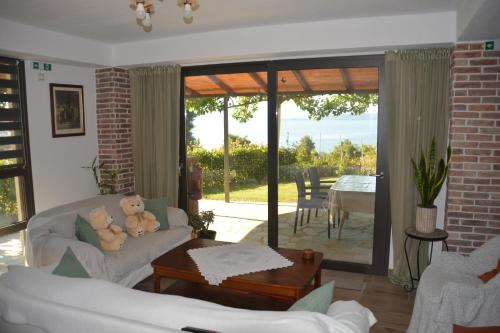 a living room with a couch and a table at Thalantheia House in Agios Konstantinos