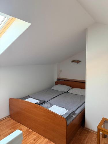 a bedroom with a bed in a room at Lumier Apartment in Zelenika