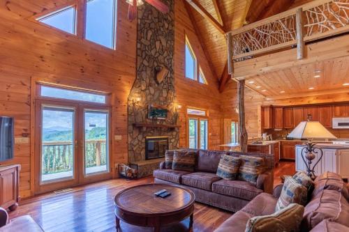 a living room with a couch and a table at Sunset View Lodge in Elk Park