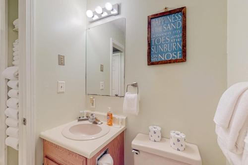 a white bathroom with a sink and a mirror at Wellington Manor 240 in Wells