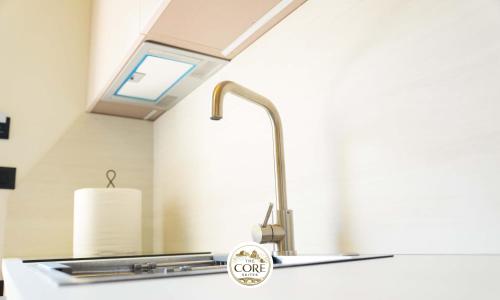 a kitchen sink with a stainless steel faucet at The Core Lezhe in Lezhë