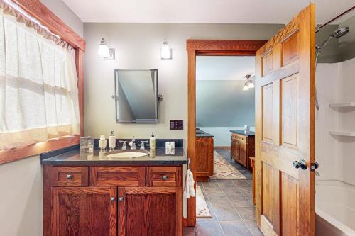 a bathroom with a sink and a mirror at The Loft at Fort Defiance in Barnard