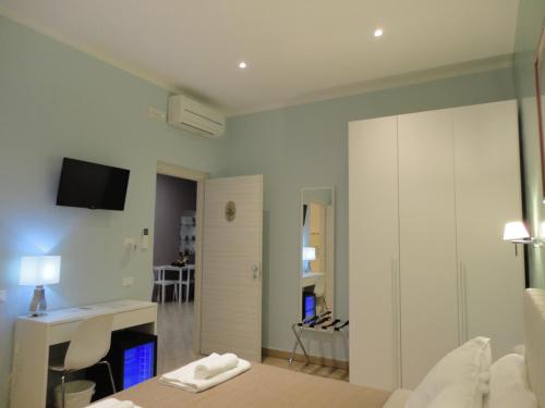 Postel nebo postele na pokoji v ubytování Guest House Le Tre Spezie