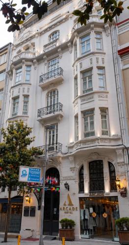 a white building with a store in front of it at Arcade Hotel & SPA Nisantasi in Istanbul