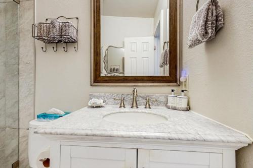 a bathroom with a white sink and a mirror at Jarvis #301 in Durango