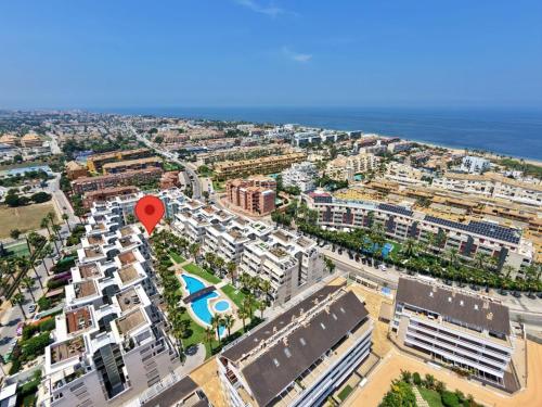 an aerial view of a city with a red marker at Apartment Élegance by Interhome in Denia