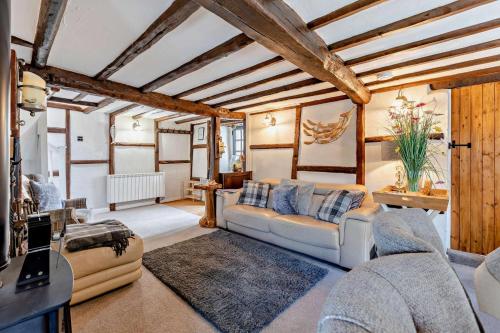 a living room with a couch and a table at 2 Bed in Croyde oc-smithc in Croyde