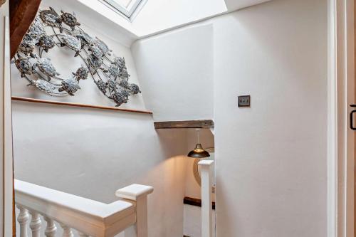 a staircase in a house with white walls and a ceiling at 2 Bed in Croyde oc-smithc in Croyde