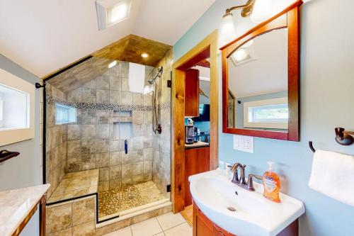 a bathroom with a shower and a sink at The Lodge - Suite #3 in Waterbury