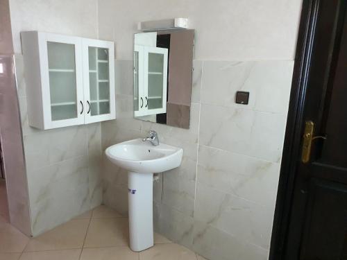 a bathroom with a sink and a mirror at la sublime in Taghazout