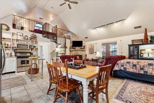 a kitchen and living room with a table and chairs at Longacre of Appomattox in Appomattox