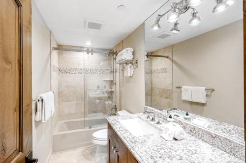 a bathroom with a sink and a tub and a toilet at Ketchum Bliss in Ketchum