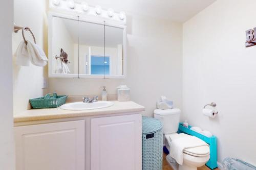 a bathroom with a sink and a toilet at Little Gem at Hampton Beach in Hampton