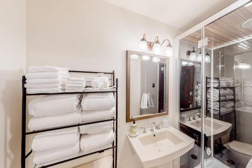 a white bathroom with a sink and a mirror at Ideal in Idaho in Ketchum