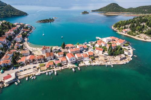 an aerial view of a small island in the water at Margaritum Blace - Seaview Apartment with Balcony in Blace