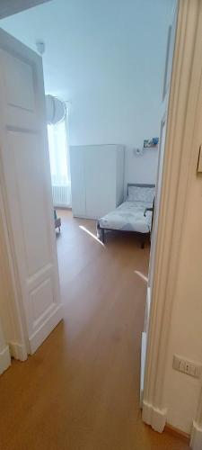 a room with a bed in the middle of a room at Civico 16 in Sulmona
