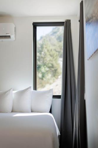 a bedroom with a bed and a window at Mountain View in Orderville