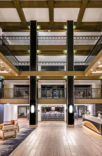 a lobby of a hotel with couches and tables at Hilton Phoenix Resort at the Peak in Phoenix
